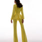 A yellow suit with a peplum jacket and flared pants