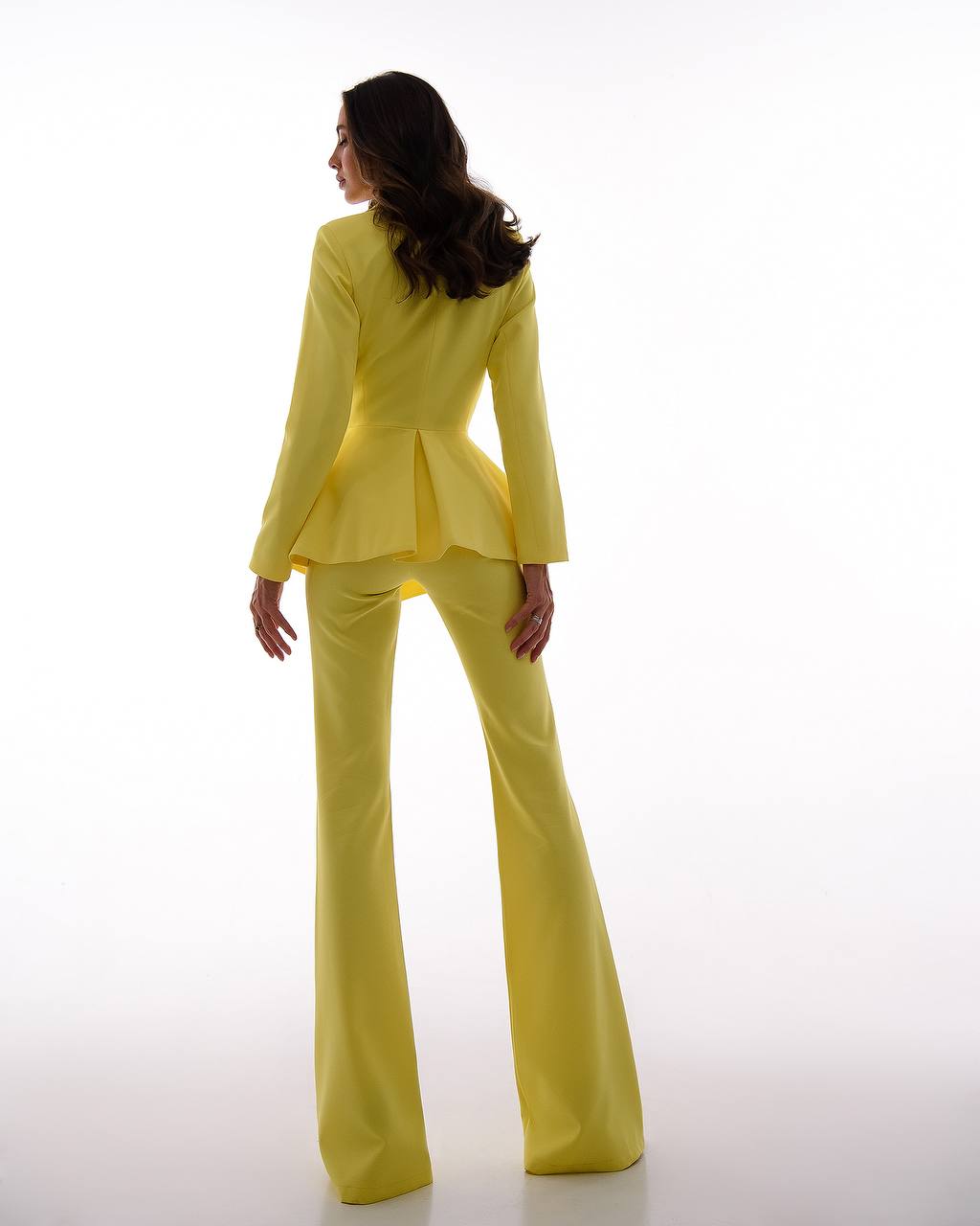 A yellow suit with a peplum jacket and flared pants