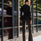 A black suit with a peplum jacket and flared pants