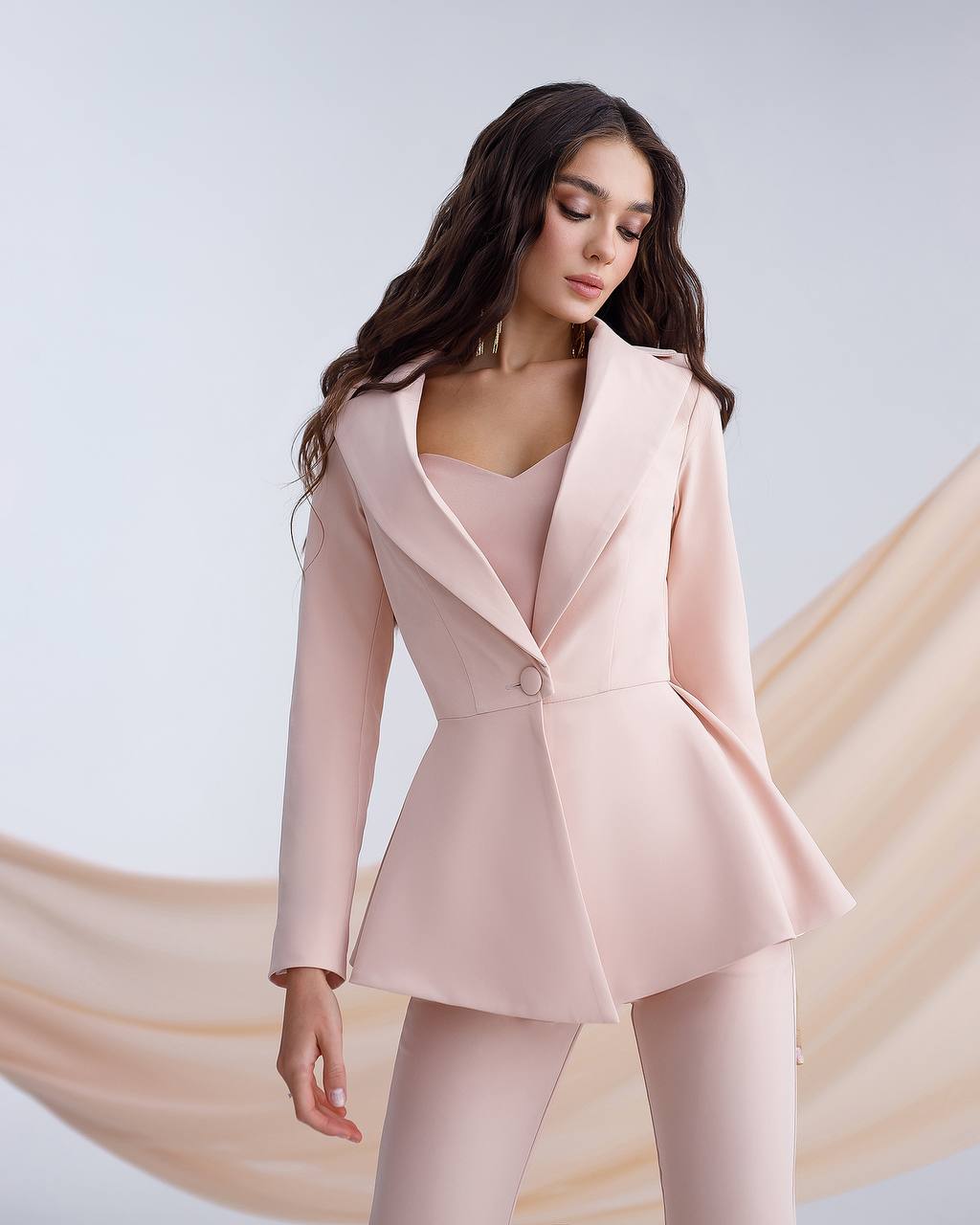 Beige suit with a peplum jacket and flared pants