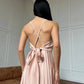 Beige dress with an open back and a lush skirt