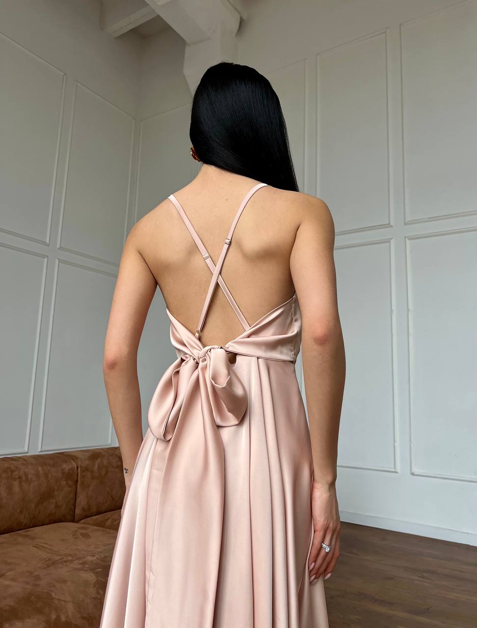 Beige dress with an open back and a lush skirt