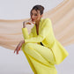 A yellow suit with a peplum jacket and flared pants