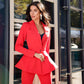 A red suit with a peplum jacket and flared pants