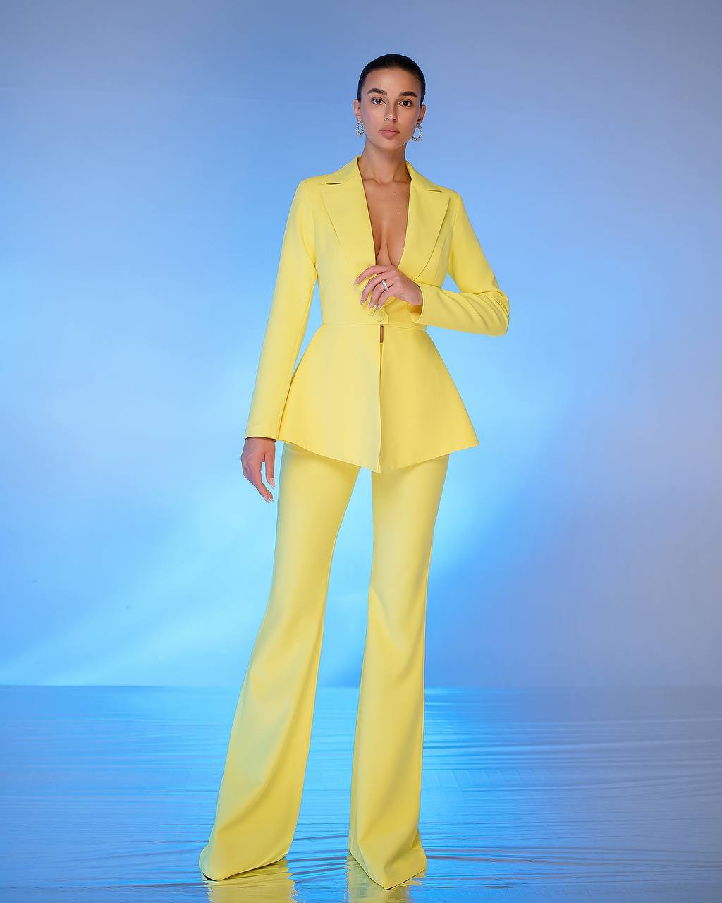 A yellow suit with a peplum jacket and flared pants