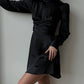 Black mini dress with open back and bow