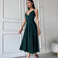 An emerald dress with an open back and a lush skirt