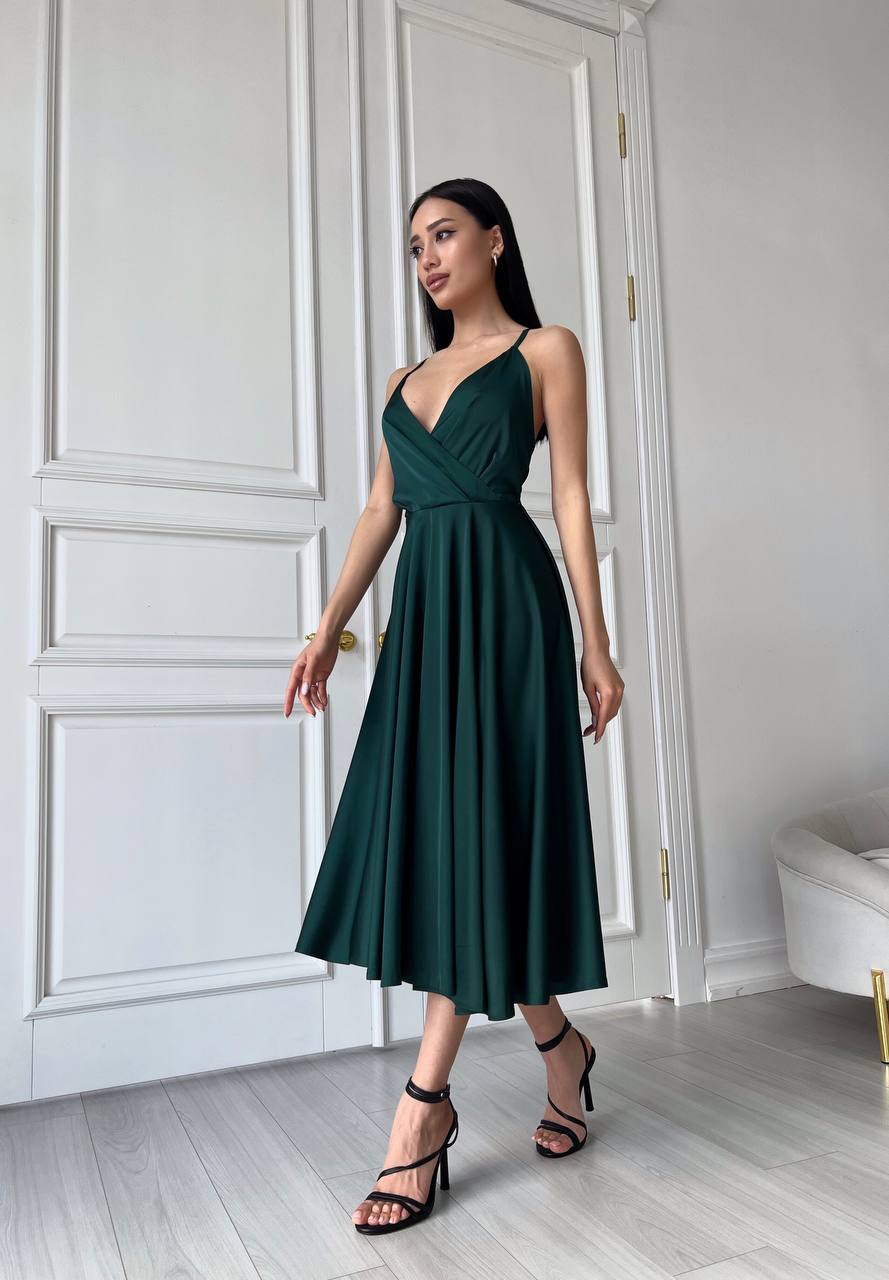 An emerald dress with an open back and a lush skirt