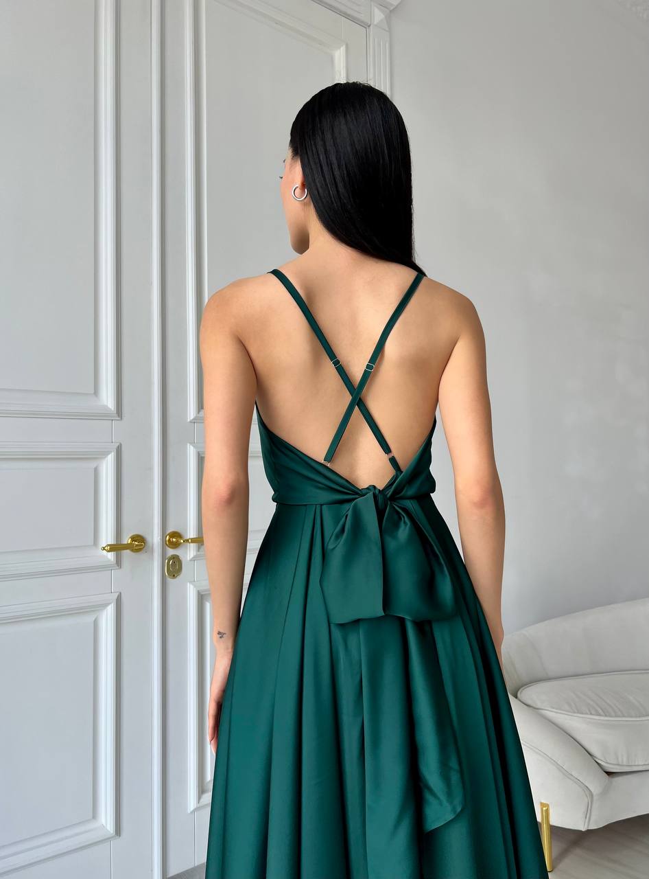 An emerald dress with an open back and a lush skirt