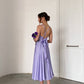 Lavender dress with an open back and a lush skirt