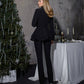 A black suit with a peplum jacket and tapered pants