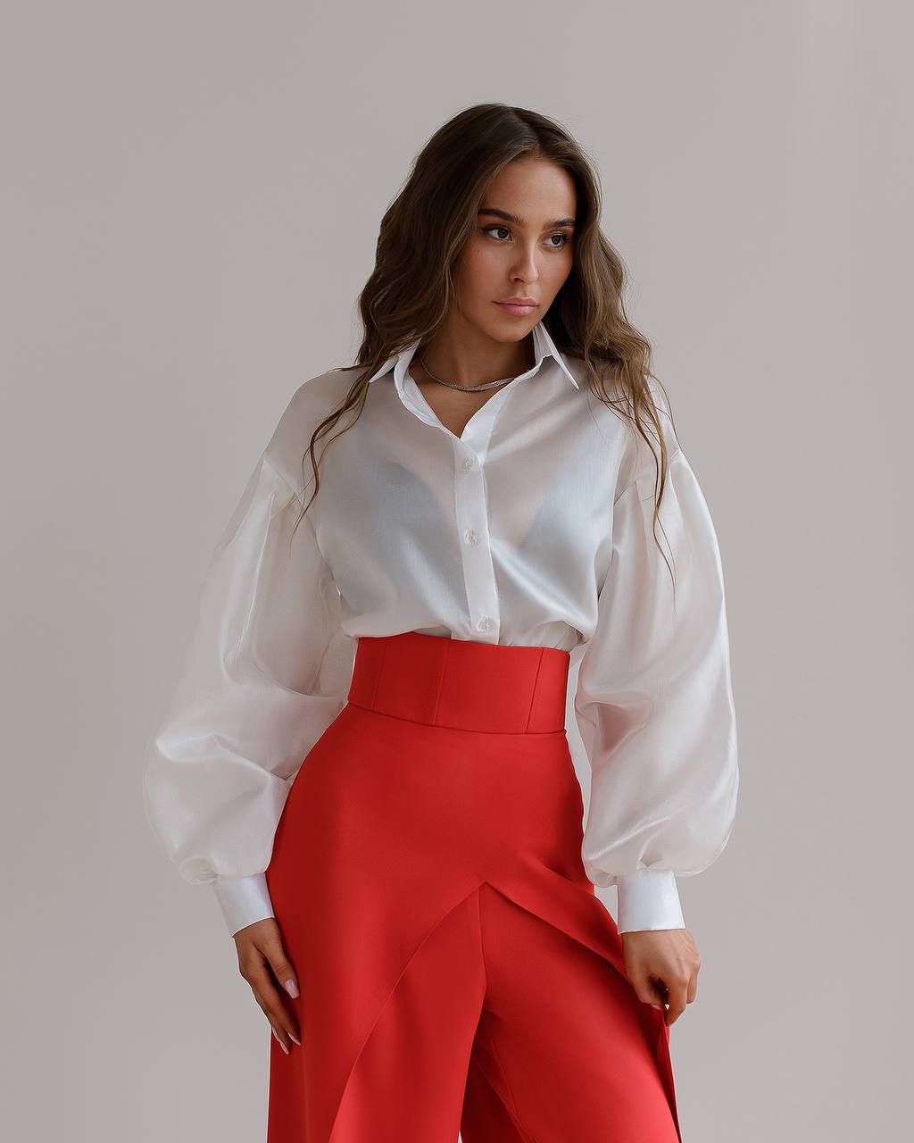 Red palazzo pants with a corset belt