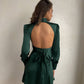 Emerald mini dress with open back and bow