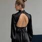 Black mini dress with open back and bow