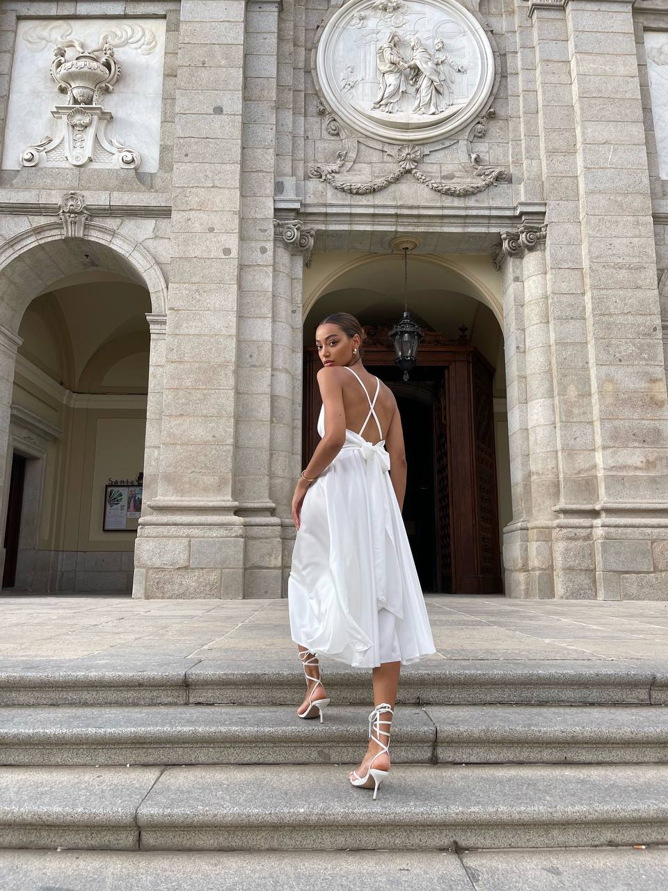 Milk dress with an open back and a lush skirt