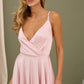 Soft pink dress with an open back and a lush skirt