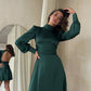 Emerald mini dress with open back and bow