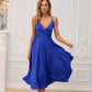 Blue dress with an open back and a lush skirt