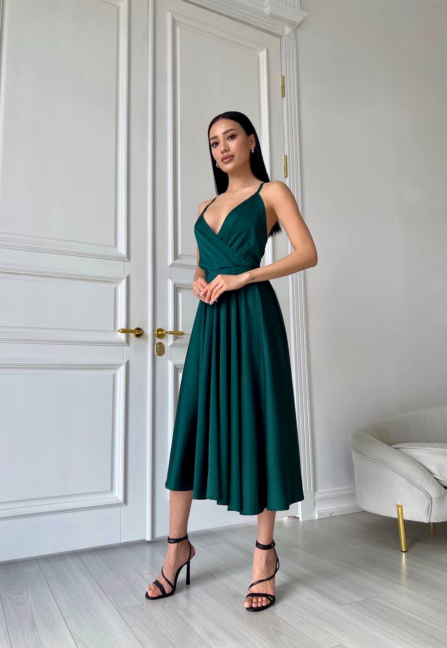 An emerald dress with an open back and a lush skirt