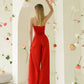 Red corset jumpsuit with slits