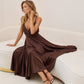 Brown dress with an open back and a lush skirt