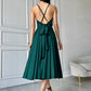 An emerald dress with an open back and a lush skirt