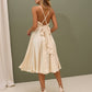 A dress with an open back and a lush skirt