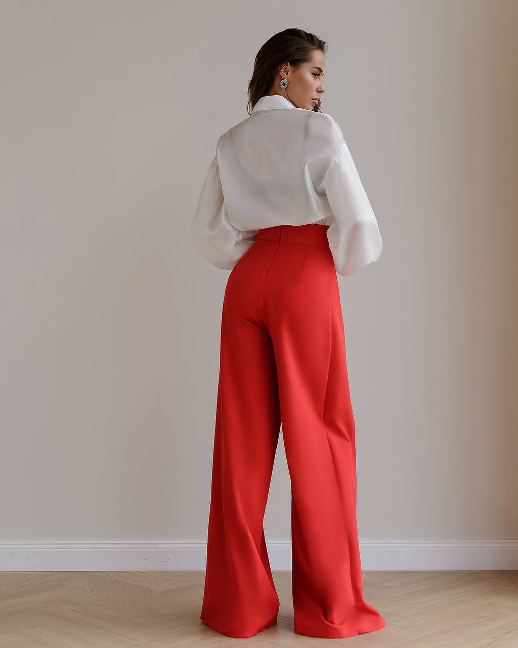 Red palazzo pants with a corset belt