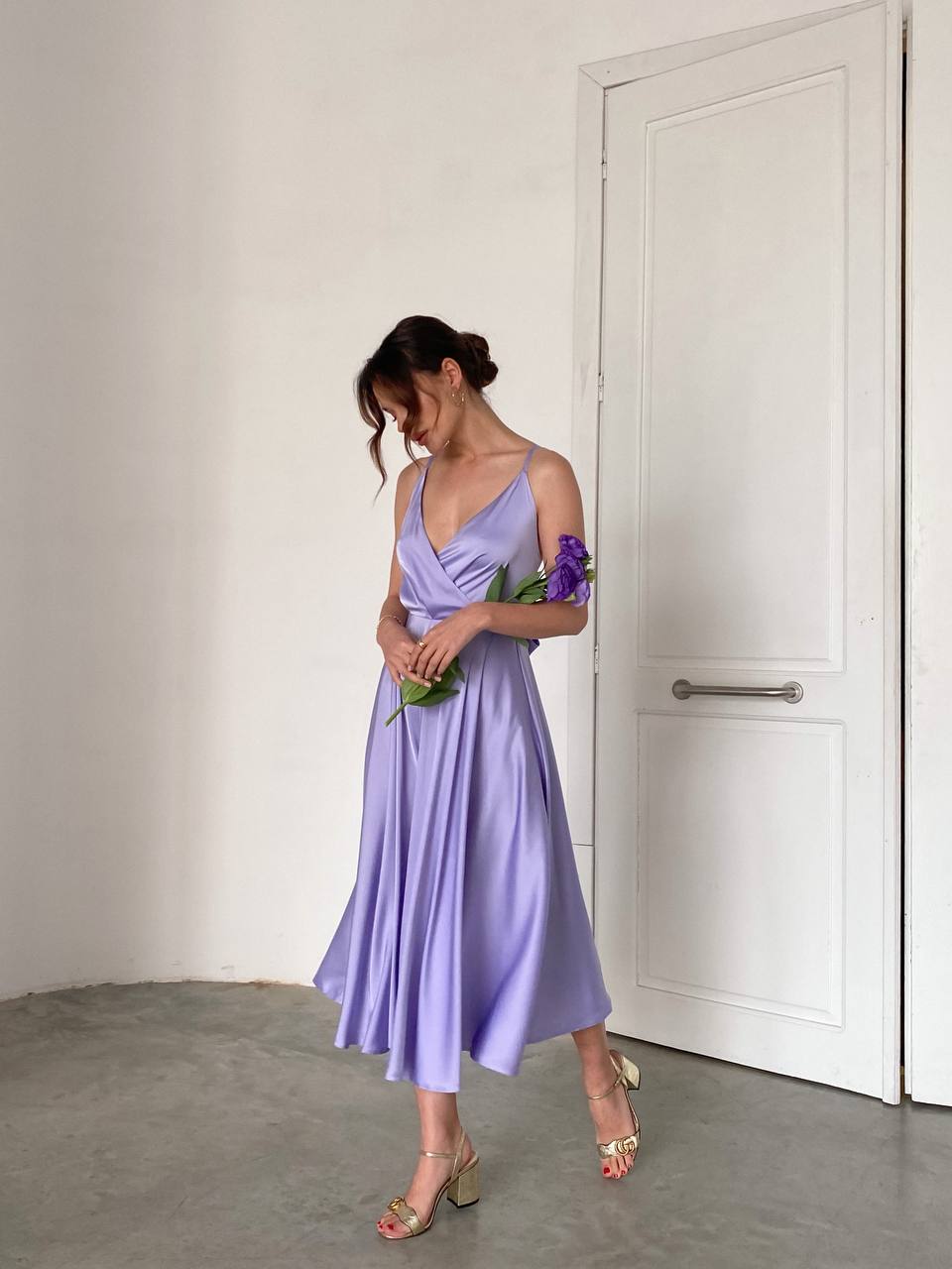 Lavender dress with an open back and a lush skirt