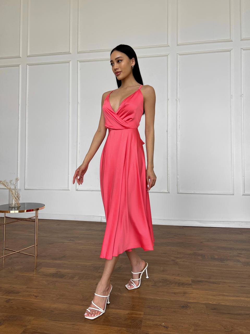 Coral dress with an open back and a lush skirt