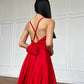 Red dress with an open back and a lush skirt