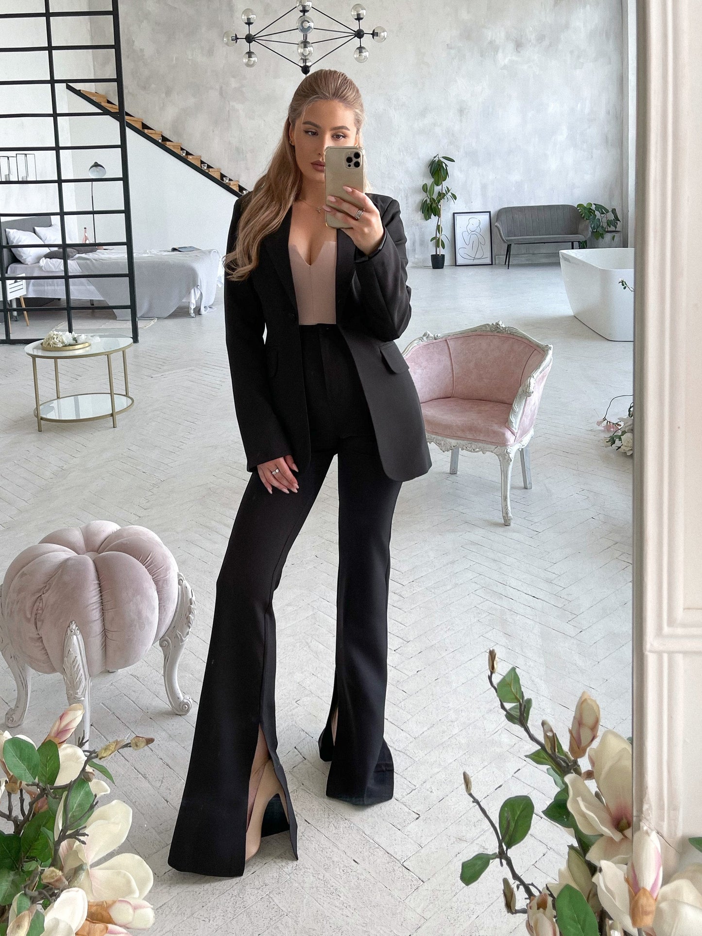 Black suit jacket and flared pants with slits