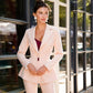 Beige suit with a peplum jacket and flared pants