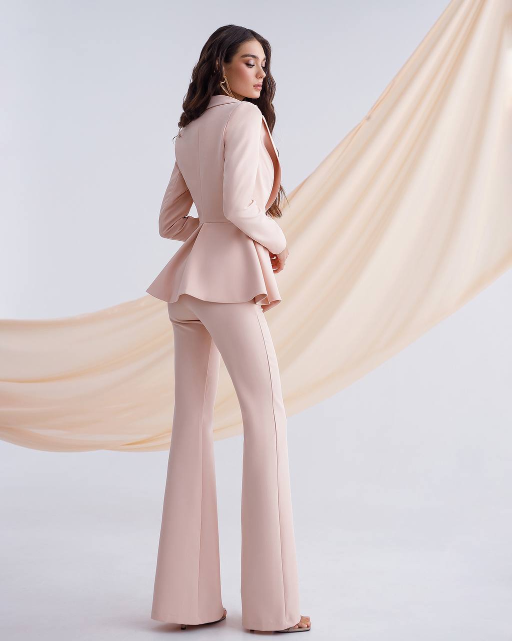 Beige suit with a peplum jacket and flared pants