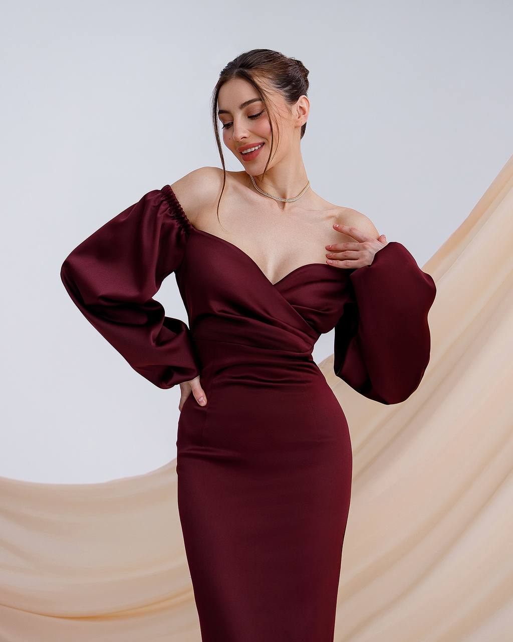 Burgundy satin dress with voluminous sleeves