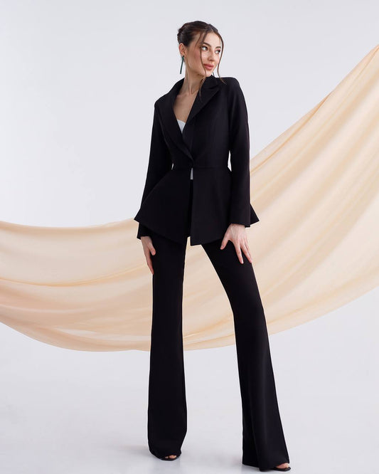 A black suit with a peplum jacket and flared pants