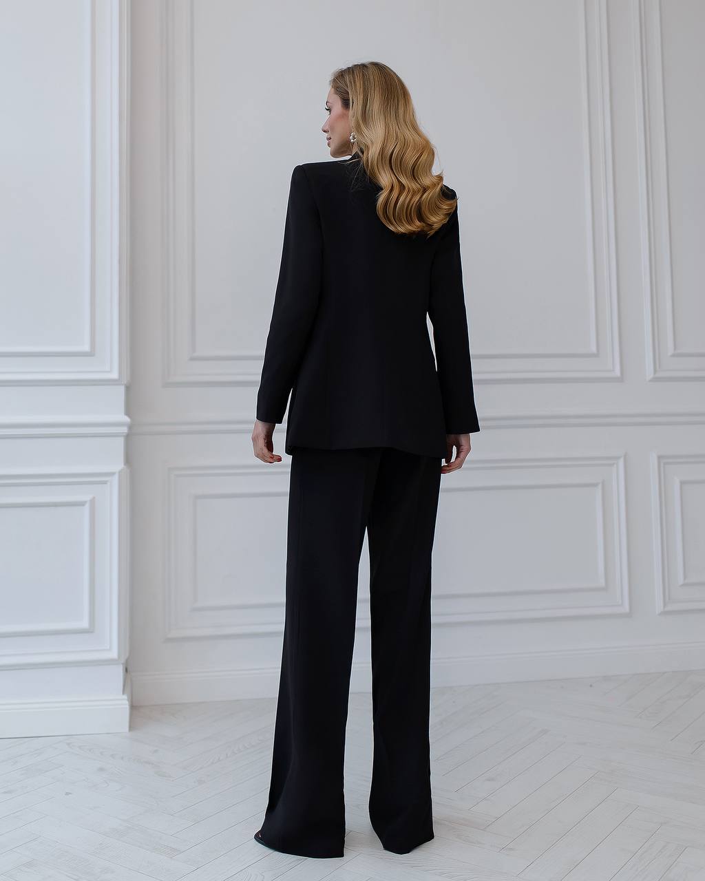 Black three-piece suit with a top