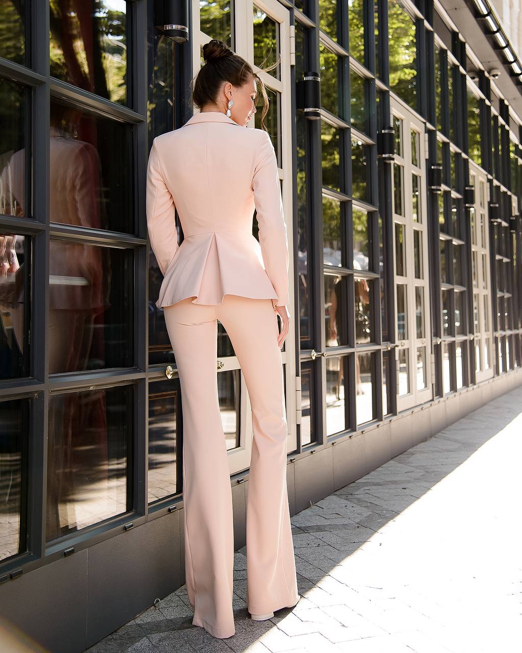 Beige suit with a peplum jacket and flared pants