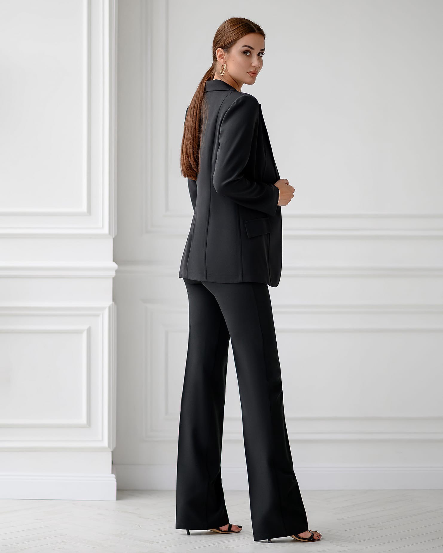 Black three-piece suit with vest and straight pants