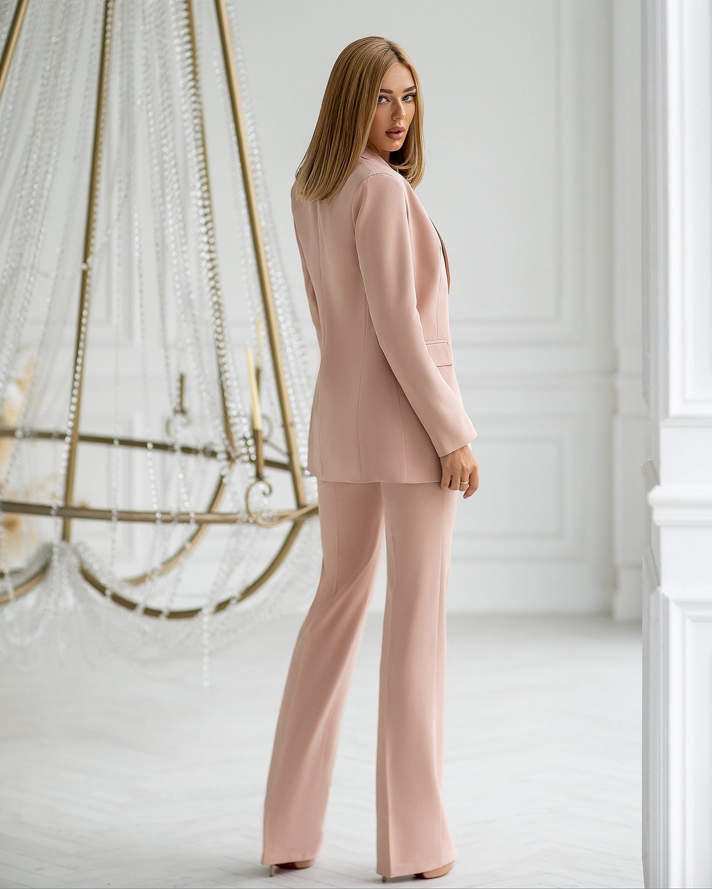 Beige three-piece suit with vest and straight pants